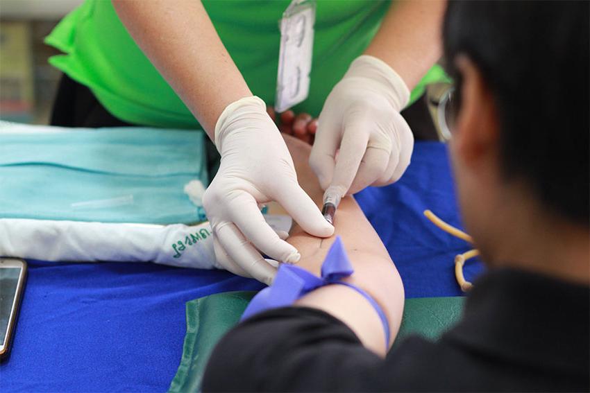 Student getting blood drawn